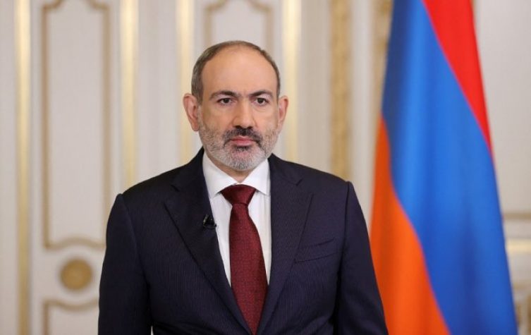 This handout picture taken and released by the Armenia's Government press service on April 25, 2021 shows Armenian Prime Minister Nikol Pashinyan addressing to nation in Yerevan. Armenian Prime Minister Nikol Pashinyan announced on April 25, 2021 his resignation while retaining interim duties, formalising a parliamentary vote to be held June 20 in an effort to defuse a political crisis sparked by last year's war with Azerbaijan. / AFP / press service of Armenia's gover / TIGRAN MEHRABYAN